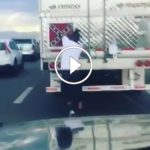 Man removes Confederate Flag on a truck